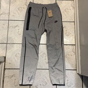 New Nike Tech Woven Flash Reflective Pants Silver Men’s Size Medium FZ7587-035